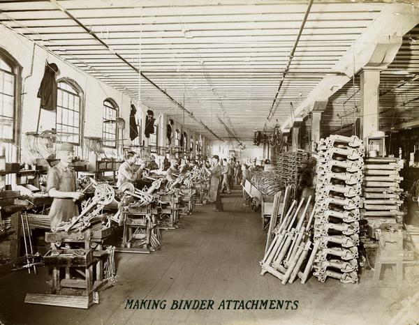 Workers making binder attachments in the binder attachment department at the McCormick Reaper Works. The factory was owned by the McCormick Harvesting Machine company before 1902. In 1902 it became the McCormick Works of the International Harvester Company. The factory was located at Blue Island and Western Avenues in the Chicago subdivision called "Canalport." It was closed in 1961.