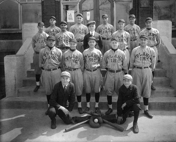 Baseball players and bat boys for the International Harvester Plano Works baseball team. The team was part of the Harvester league.