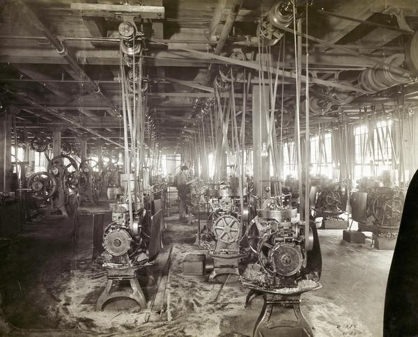 Rows of belt-driven machines inside the "automatic screw machine shop" at International Harvester's McCormick Works(?). According to the original caption: "all small finished steel parts, such as set screws, studs, pins, small shafts, etc., are turned on automatic machines, which insures absolute uniformity and exact size in every particular."