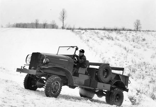 Driver field testing an International M-2-4 truck manufactured at International Harvester's Springfield Works for the U.S. Marine Corps.