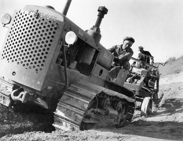 Workers terracing land with McCormick-Deering T-40 TracTracTor (crawler tractor) as part of the Las Posas Valley Project near Santa Paula, California.