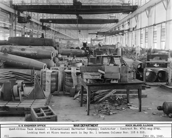 Interior of the tank arsenal at International Harvester's Bettendorf Works. Original caption reads: "Looking west at Micro Westco work in bay no. 1 between Columns nos. 153 and 253."