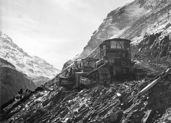 International TD-24 and TD-18 TracTracTors (crawler tractors) at work on the site of the Mauvoisin Dam in Switzerland's Mont Blanc region. The dam, begun in 1951, was built across the Dranse de Bagnes river, which flows north out of the Alps from Mauvoisin.