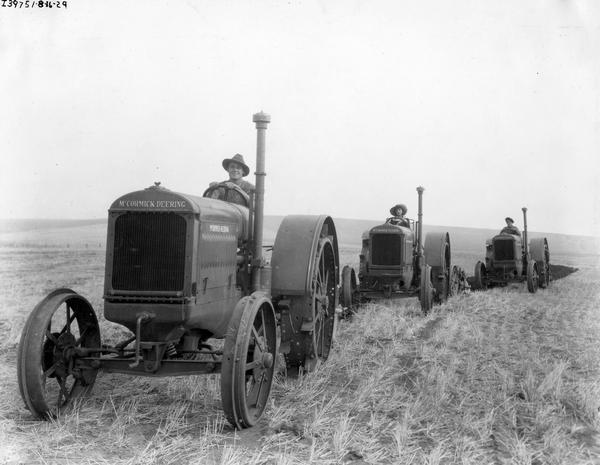 Two actors and an actress plowing a field with McCormick-Deering 15-30 tractors for the Fox Film production "Our Daily Bread".