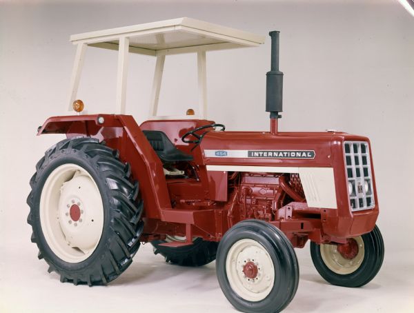 Color studio photograph of an International 454 tractor built in Great Britain.
