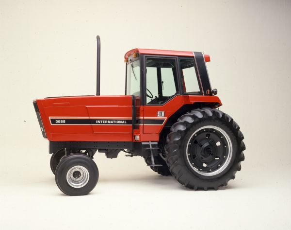 Color photograph of an International 3688 tractor in a studio.