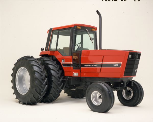 Color photograph of an International 5488 tractor in a studio.