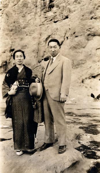 Mr. Asai and a woman (his wife?) standing on a rock. Mr. Asai was an International Harvester Company agent in Japan.