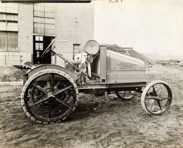Engineering photograph of an experimental 8-16(?) tractor outside of a factory.