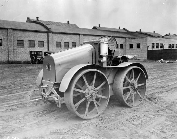 Engineering photograph of an experimental 8-16(?) tractor in a factory yard.