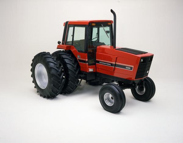Color photograph of an International 5288 tractor with dual rear wheels in a studio.