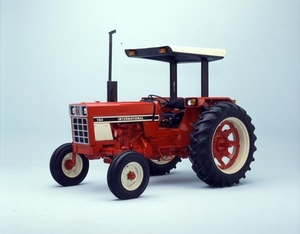 Color photograph of an International 784 tractor in a studio.