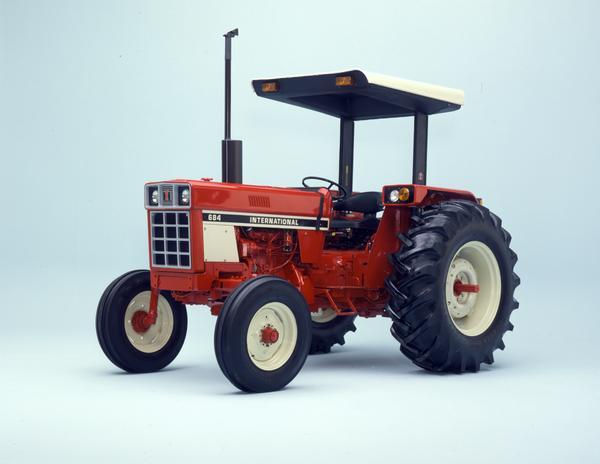 Color photograph of an International 684 tractor in a studio.