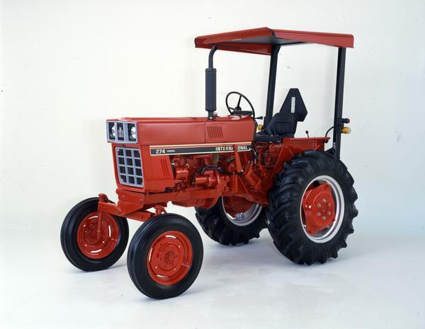 Color photograph of an International 274 diesel tractor in a studio.