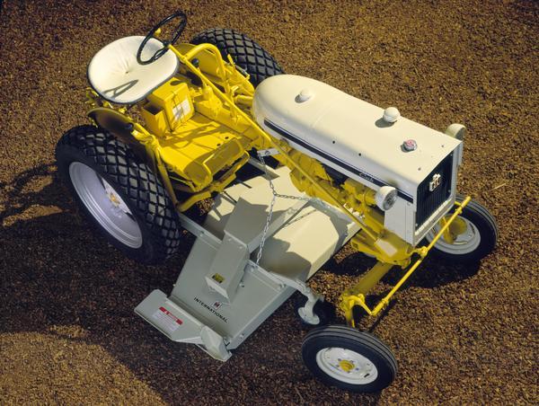 Color photograph of an International Cub tractor with model C-3 mower.