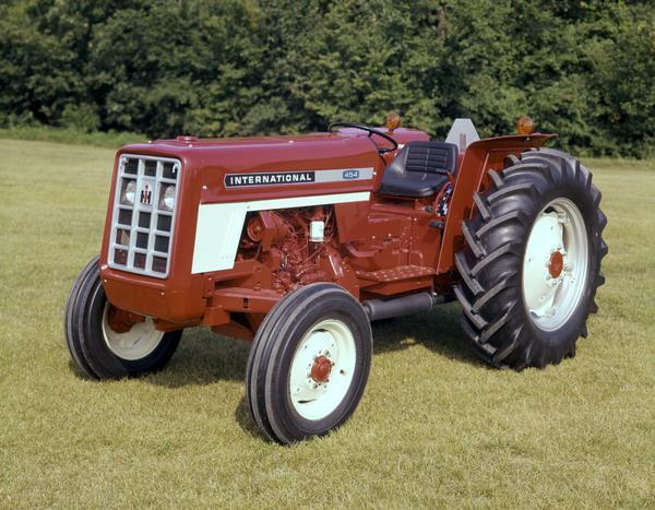 Color photograph of an International 454 tractor on a mowed lawn.