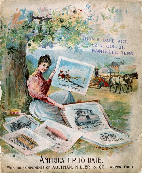 Front cover of an advertising catalog for Aultman, Miller and Company, manufacturers of agricultural equipment. Features a  chromolithograph of a woman sitting under tree with a portfolio of prints or sketches. The prints show the Buckeye mower, electric locomotive, bicycle, air ship, trolley car and horseless carriage as examples of modern inventions. A caption reads "America Up to Date." A man operating a horse-drawn grain binder is in the background.