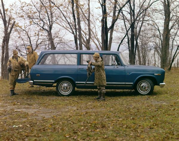 Color advertising photograph of duck hunters displaying their kills outside an International Travelall 1000 pickup. A hunting dog is standing on the open tailgate of the truck.