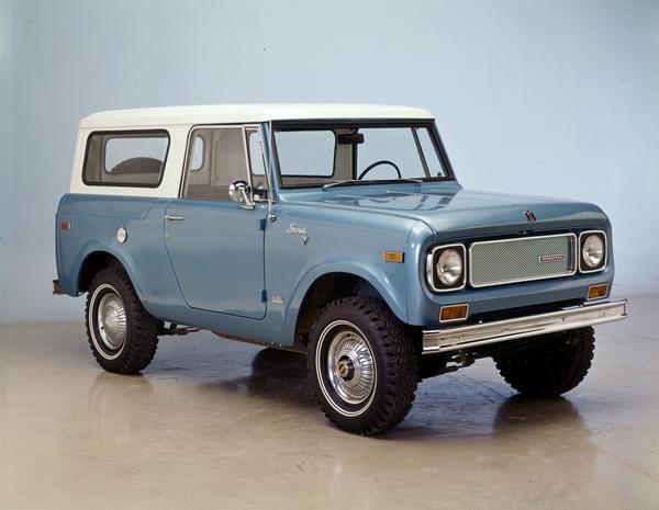 Color advertising photograph of an International Scout 4x4 pickup truck with traveltop in a studio.