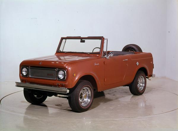 Color photograph of a 1969 International Scout 800A Roadster 4x4 with top removed. The truck is parked in a studio or showroom.
