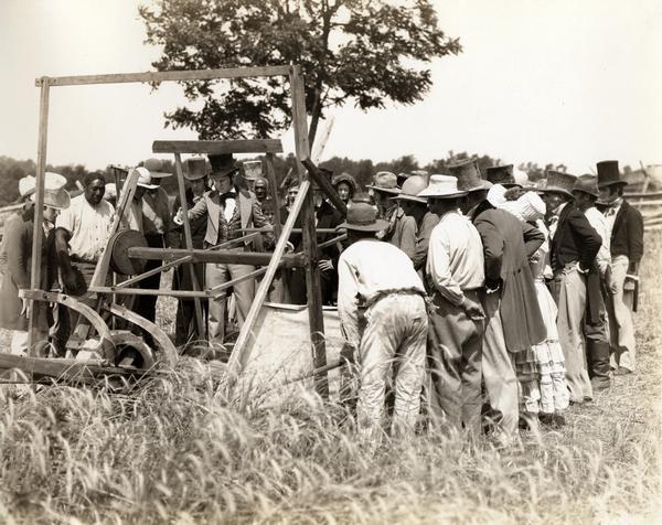 Still from the feature length motion picuture "Romance of the Reaper" showing a recreation of the demonstration of Cyrus McCormick's reaper of 1831 at Walnut Grove. The film was produced by the International Harvester Company to celebrate the 100 year anniversary of the invention of the reaper, also known as the "reaper centennial."