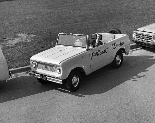 Woman parallel parking an International Scout 800 pickup as part of the "Petticoat Derby" driving competition. The event consisted of four competitive driving maneuvers that the wives of state truck driving champions tackled in Kansas City, Missouri. The event took place at the National Truck Rodeo sponsored by the American Trucking Association, Inc.