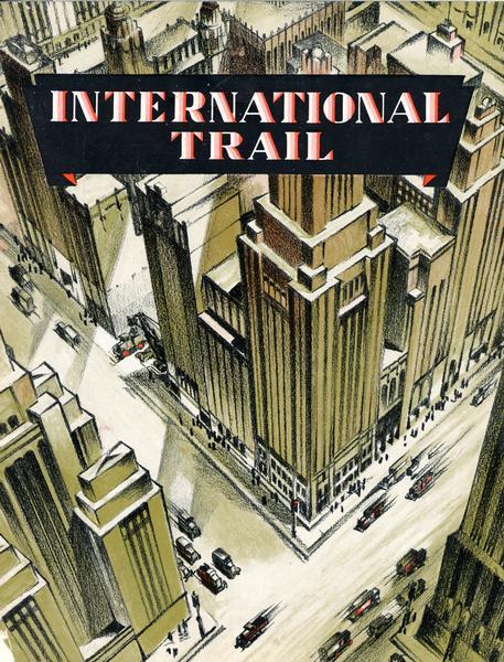 Front cover of <i>International Trail</i> magazine featuring an overhead view of city skyscrapers and downtown streets.