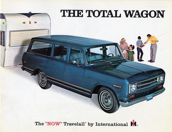 Front cover color illustration of an advertising brochure for International Travelall station wagon showing a family with a Travelall 1000 pickup and a camper under the slogan: "The Total Wagon."