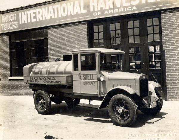International SF-36 petroleum truck owned by Roxana Petroleum Company. The truck is carrying Shell kerosene and is parked outside an International motor truck dealership.
