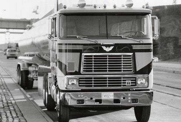 Publicity photograph of the CO-9670 Eagle tank trailer. The truck featured an "ultra-premium" cab-over heavy-duty truck design. Standard features included dual chrome air horns, snow shields, bright-finish exhaust system, bright-finish dual West Coast mirrors, bright-finish grille and full-width bumper, parking lights and bumper-mounted fog lamps.