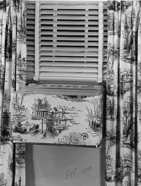 International Harvester AR-100 Air Conditioner covered with a patterned material that matches nearby curtains.