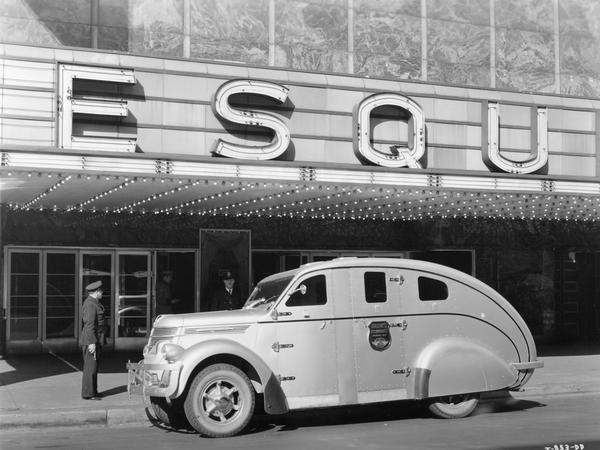 International D-30 armored truck built for Brinks, Incorporated, parked outside the Esquire Theater.