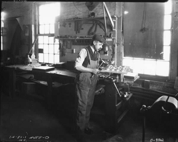 Man Working with Metal at Workbench | Photograph | Wisconsin Historical ...