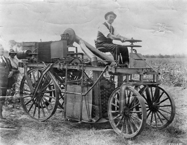 Man on the Price-Campbell cotton picker.