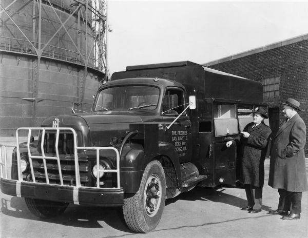 Harold Greenlee (right) and B.J. McCarthy examining a recently-delivered International model R-185 truck. Mr. Greenlee was the transportation superintendent for the Peoples Gas, Light & Coke Company. Mr. McCarthy was an International truck salesman.