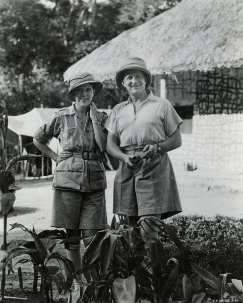 Attilio Gatti and his wife pose for the camera during their expedition to the African Congo. International Harvester sponsored the expedition and Gatti used specially designed International trucks.