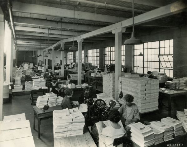 Female workers binding publications Harvester Press, International Harvester's in-house print shop.