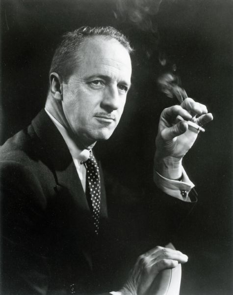 Portrait of Fowler McCormick, holding a cigarette (1898-1972). He was President of International Harvester from 1941-1946, and Chairman of the Board from 1946-1951. Fowler (full name Harold Fowler McCormick Jr.) was the son of Harold F. McCormick and grandson of Cyrus McCormick.