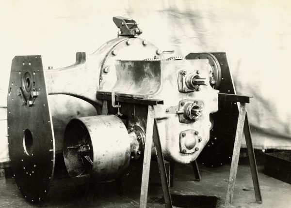 Photograph taken by International Harvester's engineering department of the transmission and rear axle of an experimental Farmall tractor. The original caption reads: "15-30 redesigned Farmall tractor - showing pulley carrier and transmission."