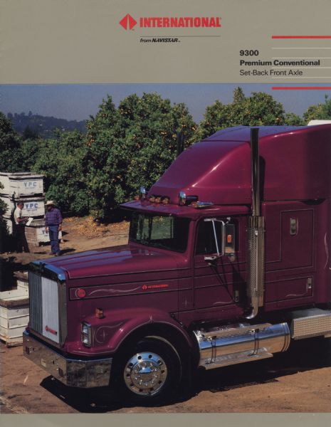 Front cover of a brochure advertising the International 9300 Premium Conventional Set-Back Front Axle semi tractor. Features a color photograph of a 9300 in an orange grove.