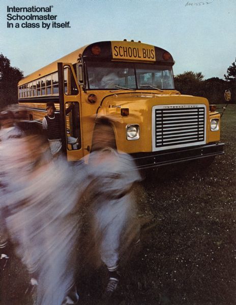 Front cover of a brochure for International Schoolmaster school buses.  Features a photograph of little league baseball players getting off a bus.