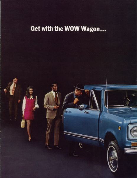 Front cover of a brochure advertising the International Scout II truck.  Features a color photograph of people lining up to examine a Scout II.  The text reads: "Get with the WOW Wagon..."