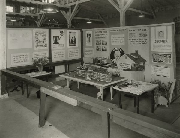 Wisconsin Lung Association informational display on tuberculosis. Featuring a model of and information on Sunnyview Sanatorium. The Wisconsin Lung Association was previously known as the Wisconsin Anti-Tuberculosis Association.