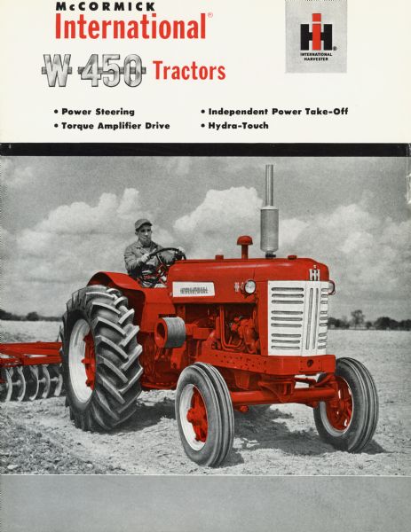 Advertising brochure for International W 450 tractors featuring color illustration.