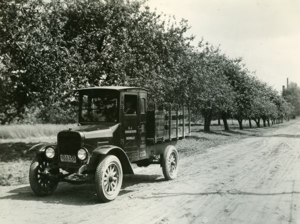 An International Harvester service truck sitting on the roadside at R.R. Robertson's orchard.
