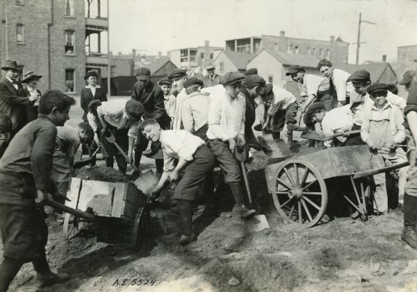 Boys from the Newberry School and Boys' Club No. 2 work on ground loaned by the Board of Education for a city garden.
