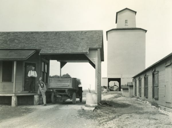 A farmer delivering grain to the elevator at Caton Station.