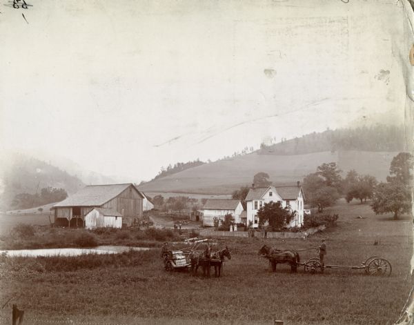 Farm scene including a horse-drawn McCormick grain binder, people, a farmhouse, and a barn.