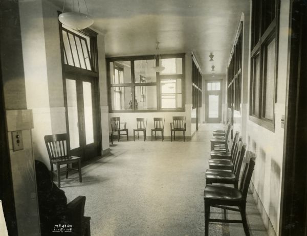 Waiting room, possibly outside the medical offices of International Harvester's McCormick Works (factory).