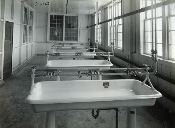 Interior view of International Harvester's Osborne Works washroom in the shear and punch department. The factory was later known as "Auburn Works".